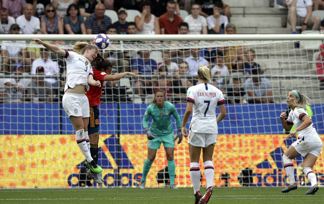 United States' Samantha Mewis, top left, jumps to defend as Spain's Patri Guijarro makes an att ...