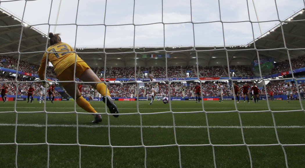 United States' Megan Rapinoe scores the opening goal from a penalty spot against Spain goalkeep ...