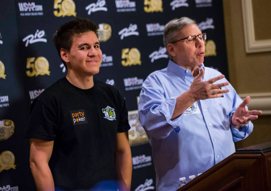 Las Vegas resident and "Jeopardy!" sensation James Holzhauer, left, looks on as Poker ...