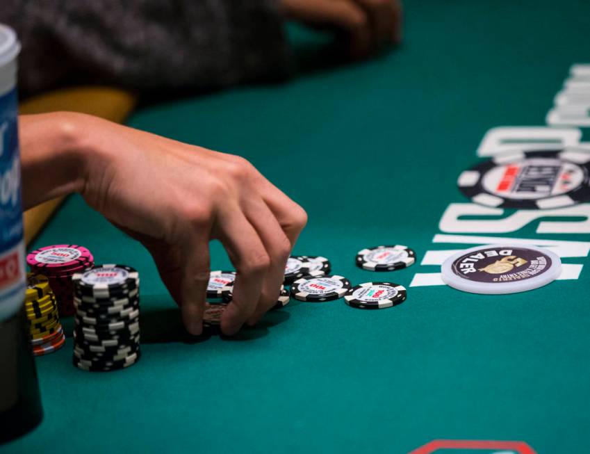 Las Vegas resident and "Jeopardy!" sensation James Holzhauer gathers chips after winn ...