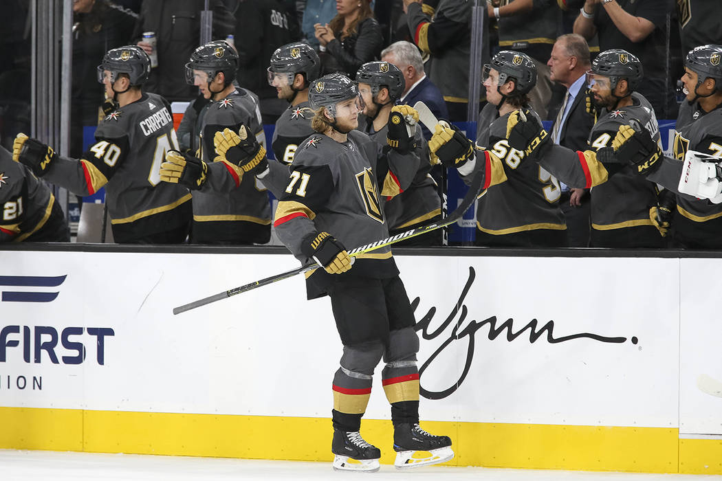 Vegas Golden Knights center William Karlsson (71) celebrate his third period goal against the B ...