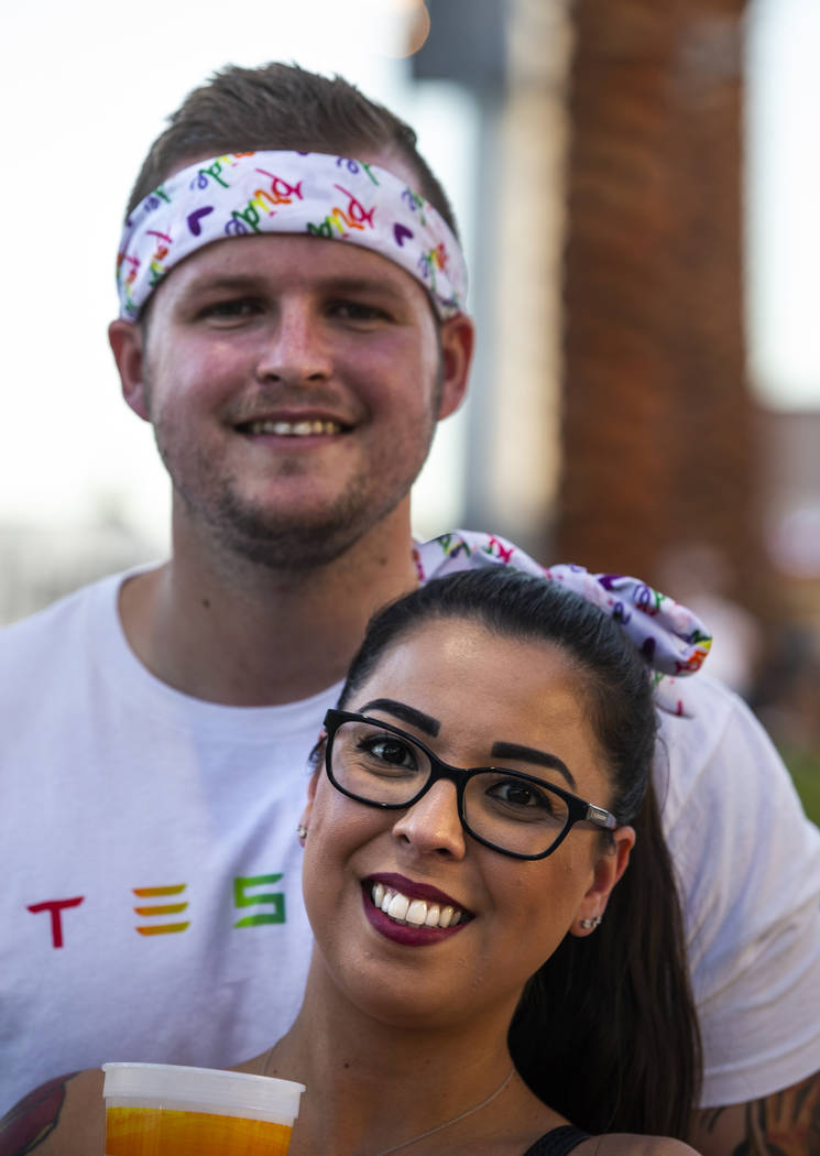 Fans Trent Dantzig and Theresa Arzola sport a Pride headband and bow during Pride Night at the ...