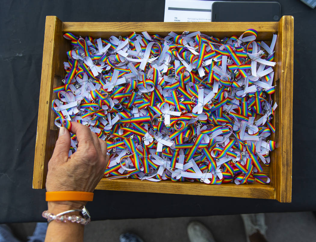 Tiny rainbow bows are free for the taking in the Pride info area beside the main concourse duri ...