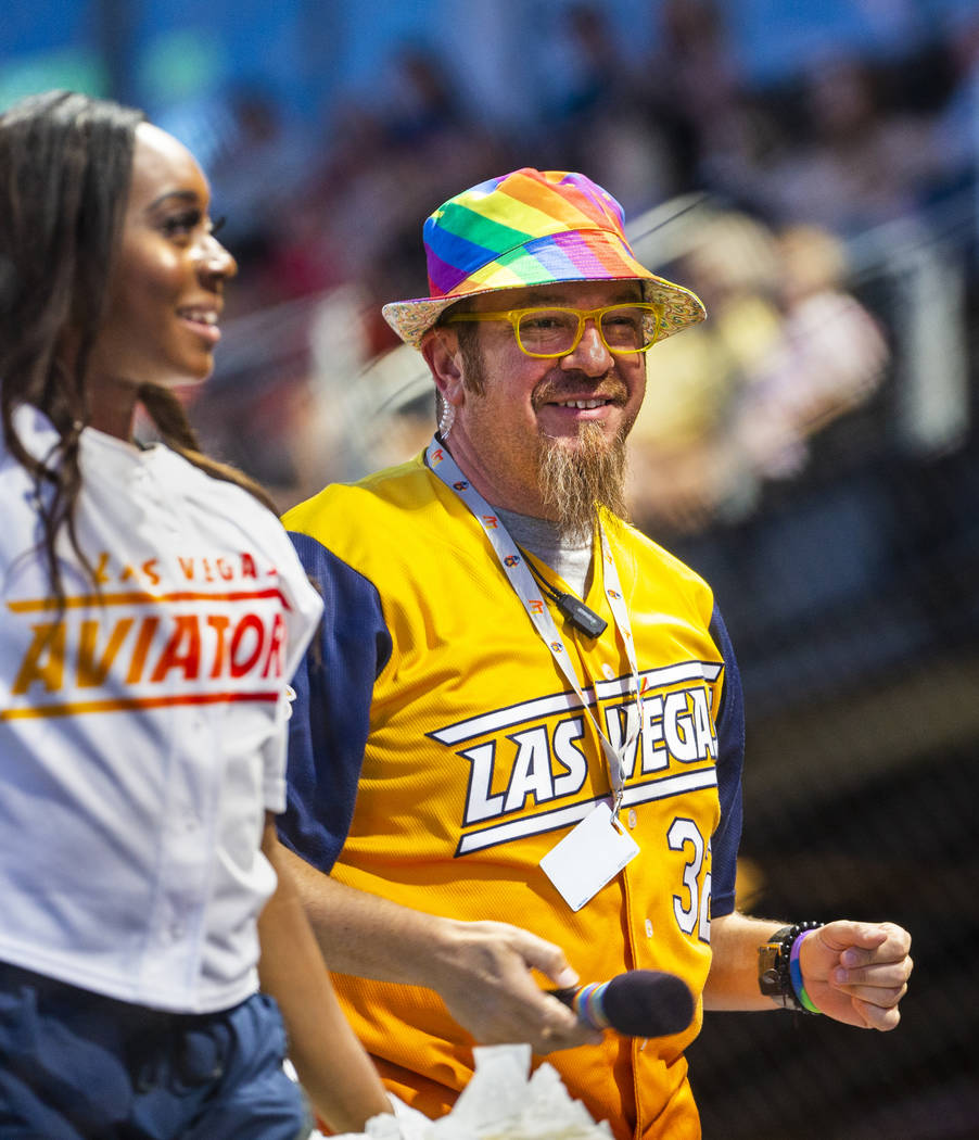 Aviators on-field emcee Andy Martello sports a rainbow hat while working the crowd during Pride ...