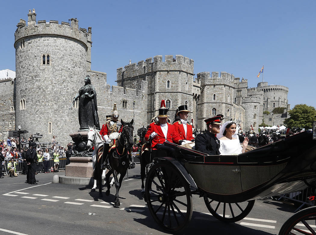 in this file photo dated Saturday, May 19, 2018, Britain's Prince Harry and Meghan Markle, righ ...