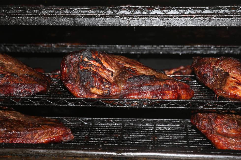 Briskets inside a pit at Big B's Texas BBQ in Henderson, Saturday, June 22, 2019. (Erik Verduzc ...