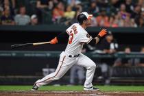 Baltimore Orioles' Joey Rickard follows through on a two-run home run against the Chicago White ...