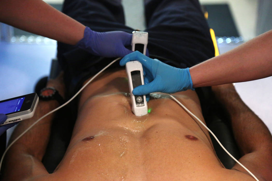 Paramedic student Thomas Vince receives an ultrasound demonstration of new technology that take ...