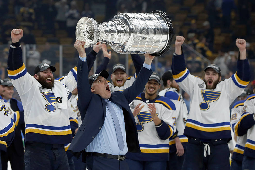 St. Louis Blues head coach Craig Berube carries the Stanley Cup after the Blues defeated the Bo ...