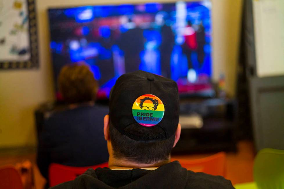 A Bernie Sanders supporter watches the Democratic presidential debate during a watch party held ...