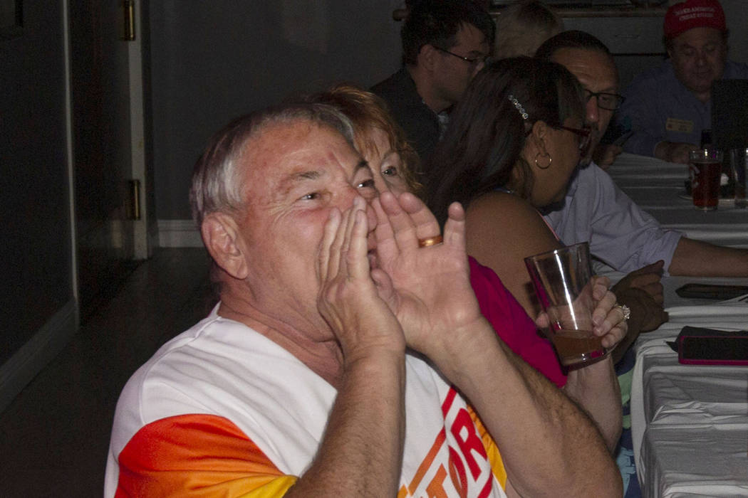 James Larocca, 69, boos while watching a Democratic primary debate during a watch party held by ...