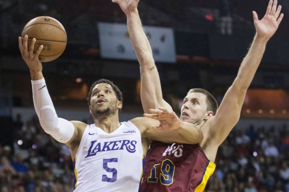 Los Angeles Lakers guard Josh Hart (5) drives past Cleveland Cavaliers forward Vladimir Brodzia ...