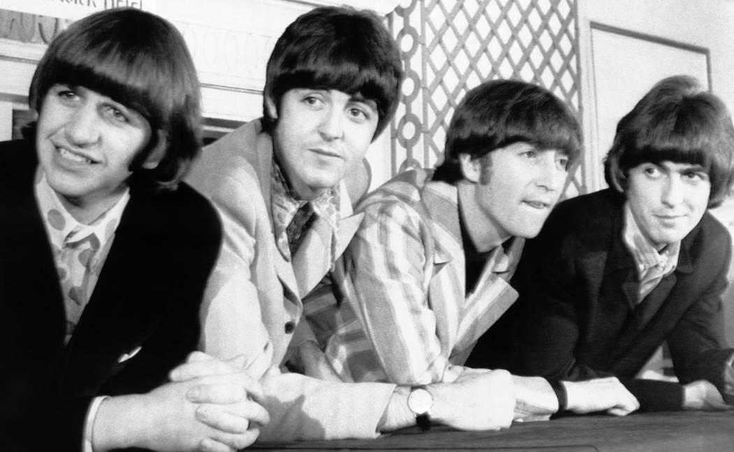 The Beatles pose for photographers during a press conference in New York on Monday, August 23, ...