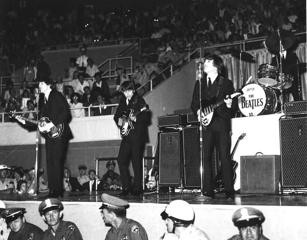 The Beatles - Paul McCartney, George Harrison, Ringo Starr and John Lennon - playing at the Con ...