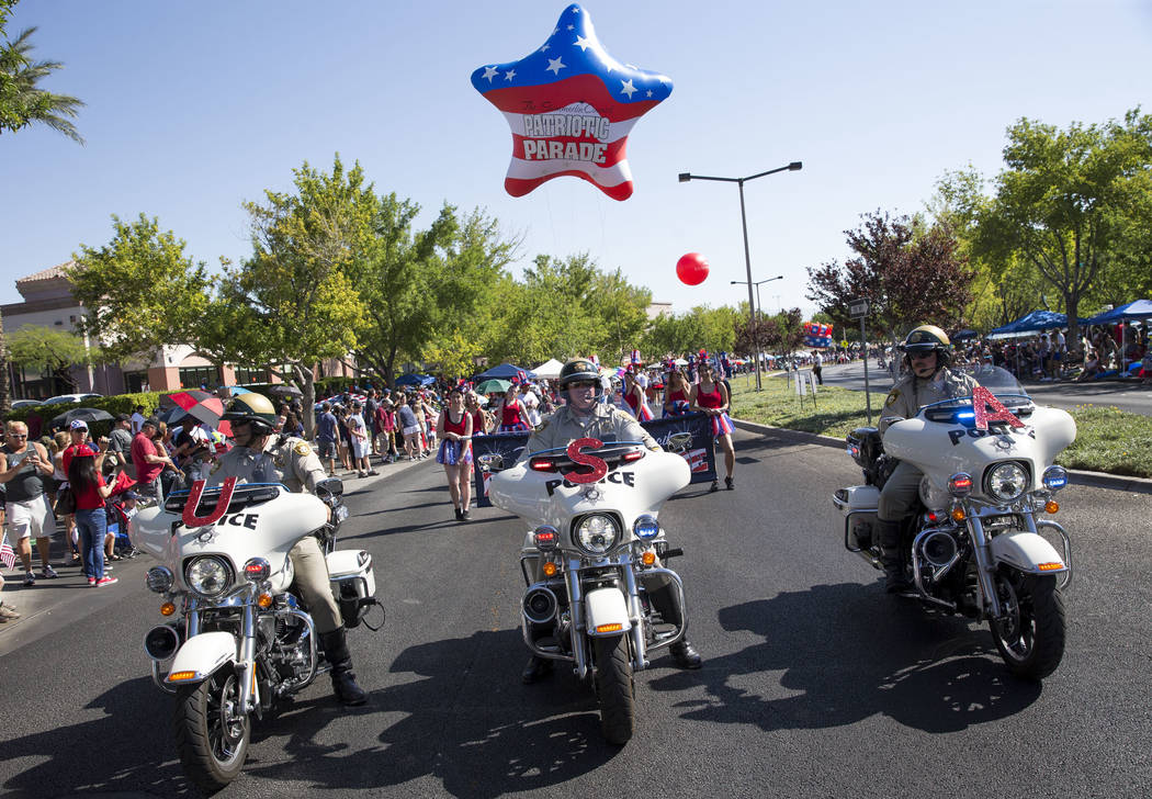 Members of the Metropolitan Police Department traffic bureau lead the start of the Summerlin Co ...