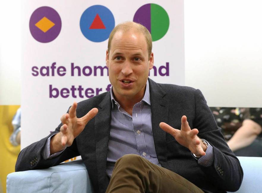 Britain's Prince William, the Duke of Cambridge, speaks to former and current service users dur ...