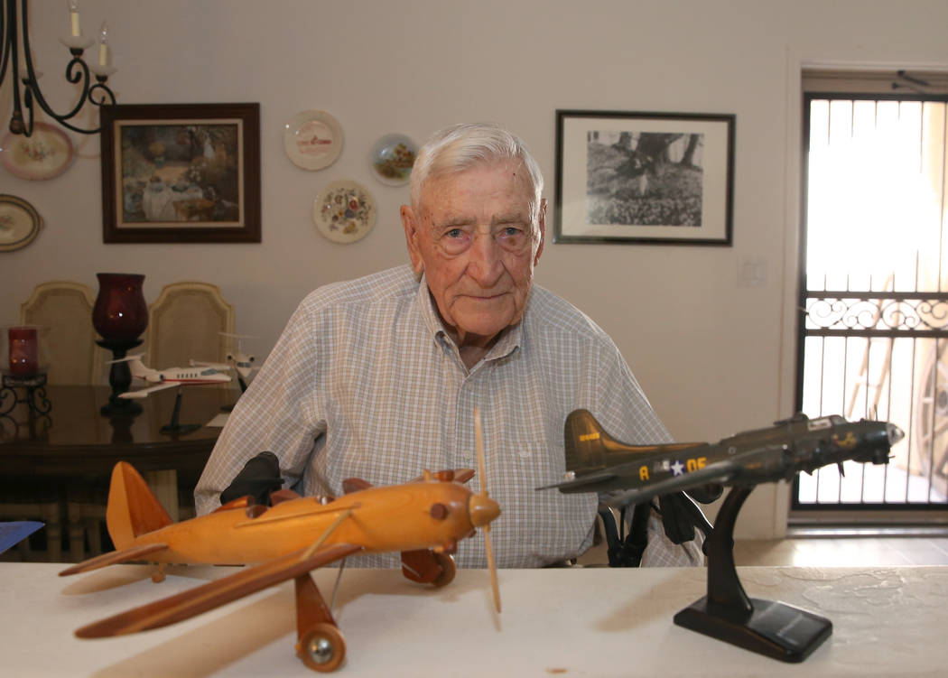 U. S. Army Air Corps and the U.S. Air Force pilot James Parker, 97, poses for a photo at his La ...