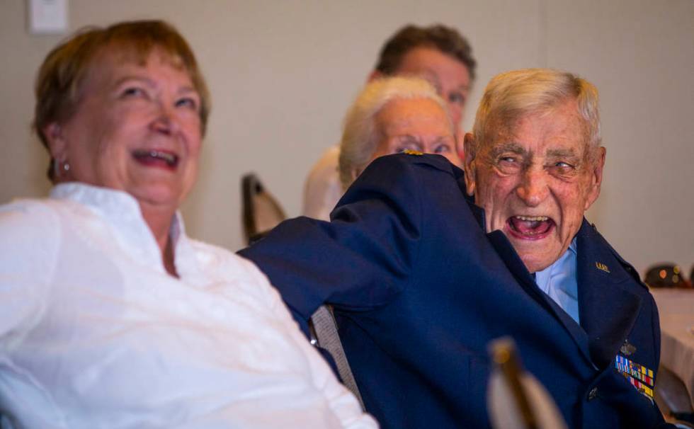 Susan Parker laughs with her father James "Jim" A. Parker while watching his life sto ...