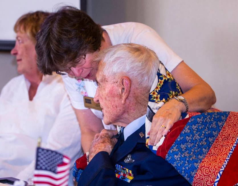 Janice Wilmot with Quilts of Valor presents James "Jim" A. Parker with a handmade gif ...