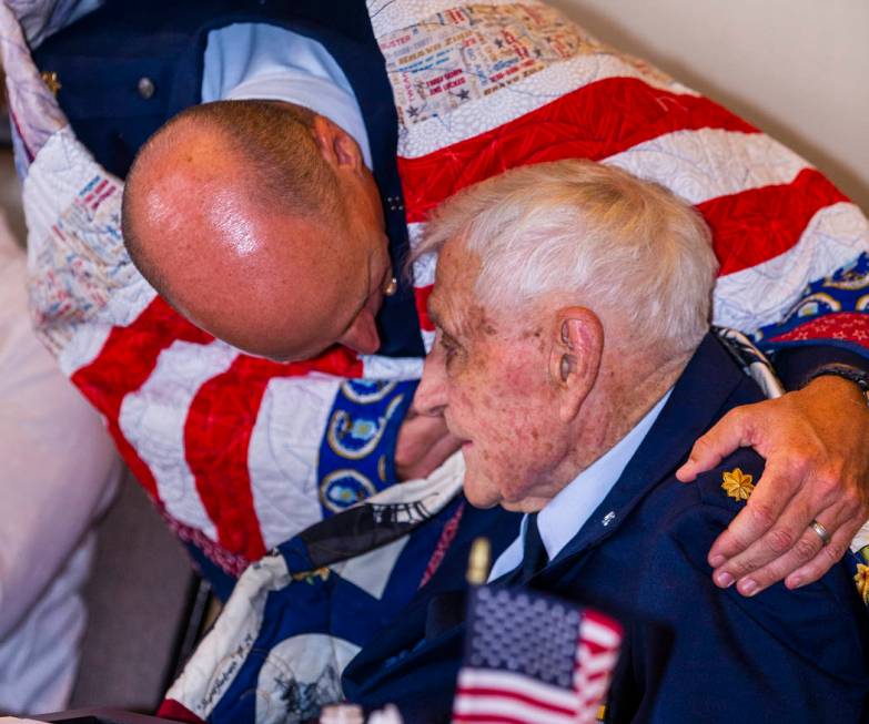 Retired Air Force Maj. Trent Arnold hugs his grandfather James "Jim" A. Parker as Th ...