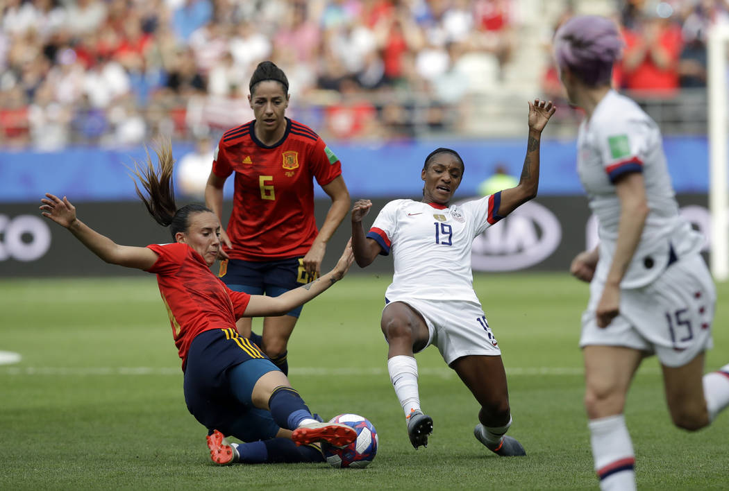 Spain's Virginia Torrecilla, left, defends against United States'Crystal Dunn, right, during th ...