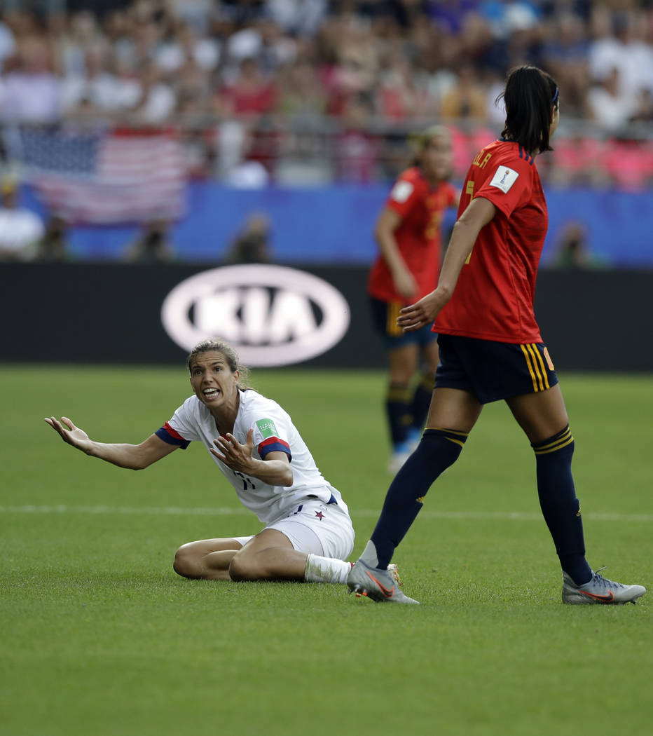 United States' Tobin Heath, left, reacts after a foul by Spain's Leila Ouahabi during the Women ...