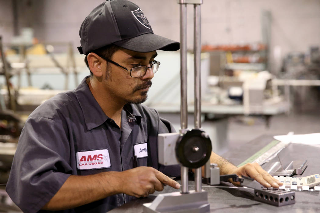 Driller Anthony Padilla makes custom hinges at Aerospace Machine and Supply in North Las Vegas, ...