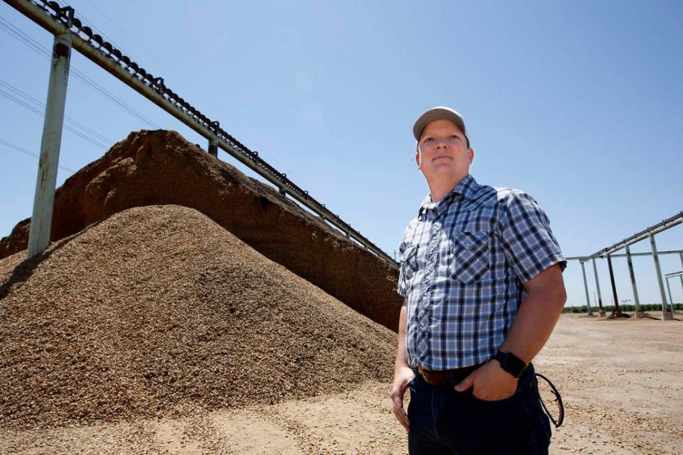 In this Friday June 21, 2019 photo, almond farmer Jake Wenger, assistant manager at Salida Hull ...