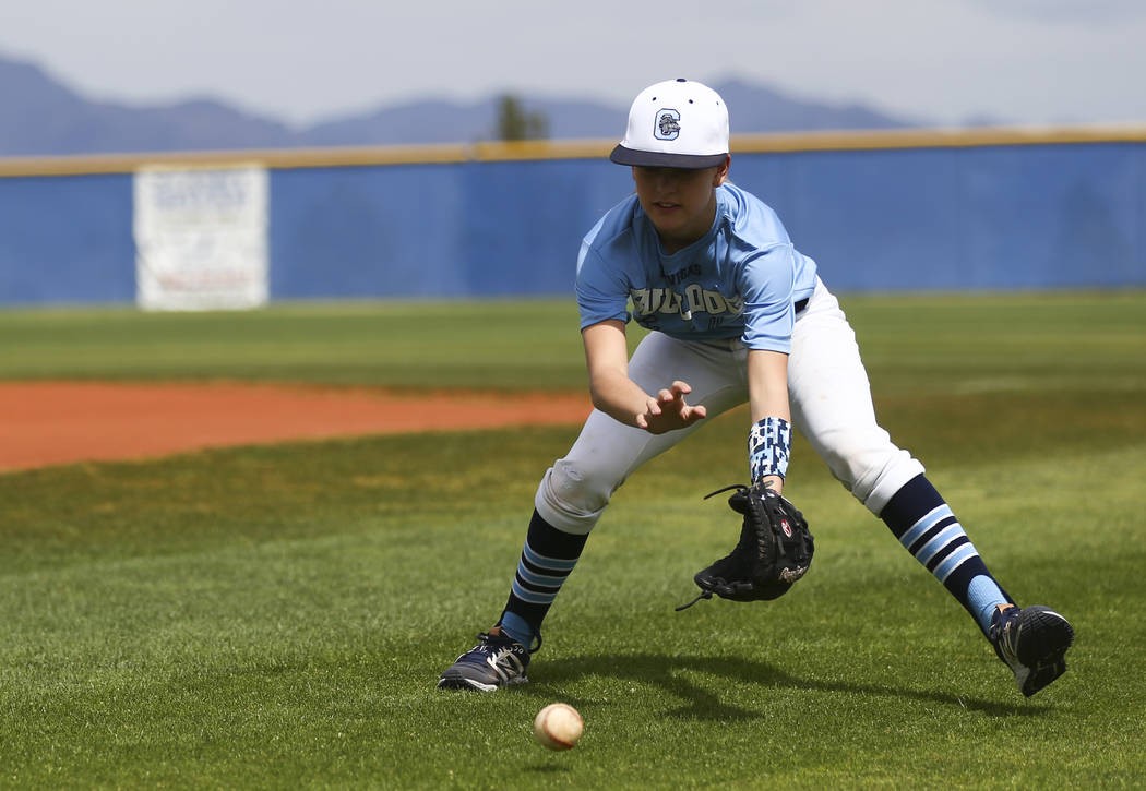 Centennial sophomore Denae Benites practices on the baseball field at Centennial High School in ...