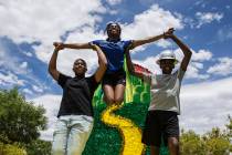 Shawn Hemphill, from left, Teshi Thomas and Malachi Moseley, members of the West Las Vegas Arts ...