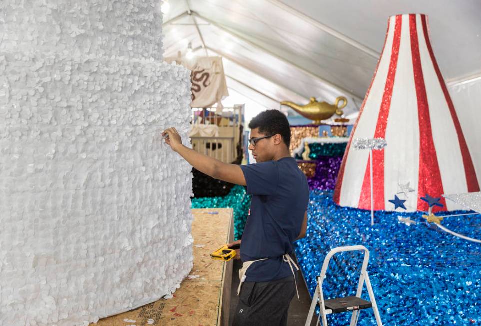 Dwight Jones works on a float during preparation for the Summerlin Patriotic Parade on Saturday ...