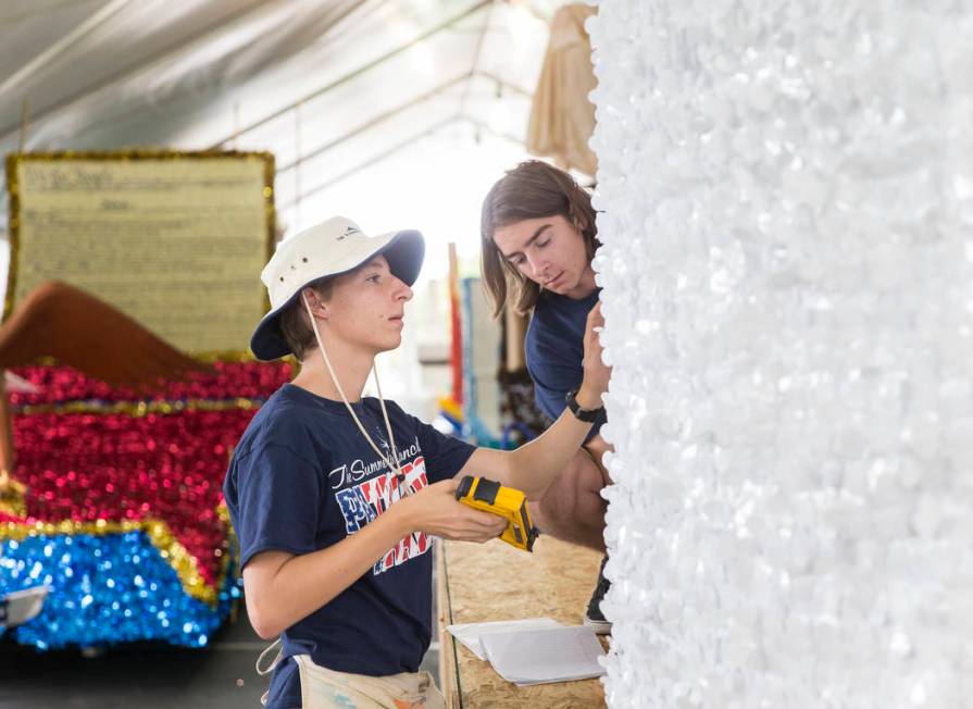 Connor Jordan, left, and Noah Jordan work on a float during preparation for the Summerlin Patri ...