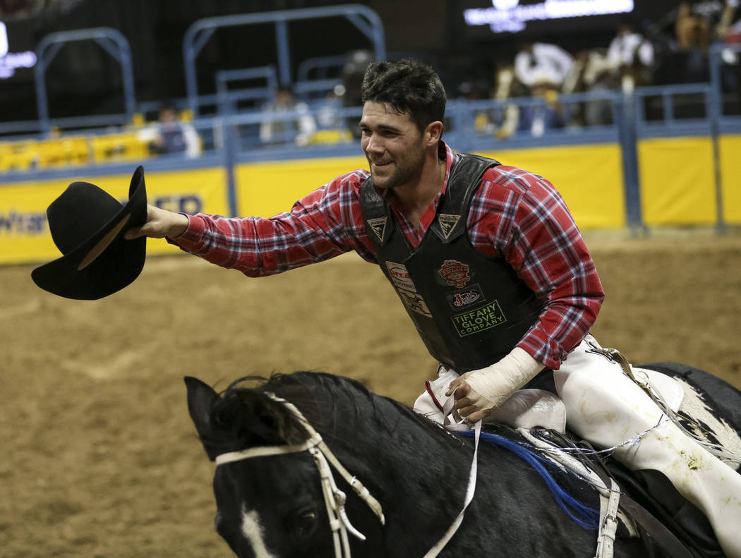 Eli Vastbinder of Union Grove, N.C. (105) takes a victory lap after taking the best score in th ...