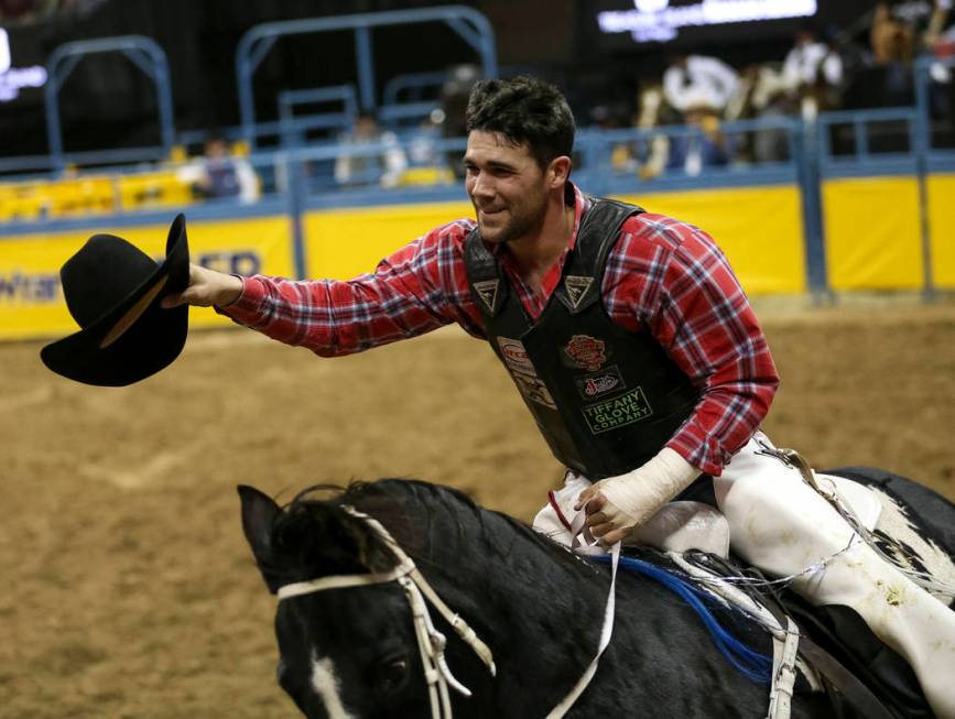 Eli Vastbinder of Union Grove, N.C. (105) takes a victory lap after taking the best score in th ...