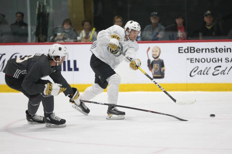 Vegas Golden Knights' Wyatt Bongiovanni, right, takes a shot under pressure from Bray Crowder d ...