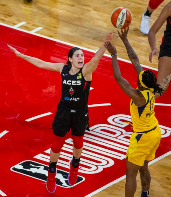 Las Vegas Aces guard Kelsey Plum defends a shot by Indiana Fever guard Erica Wheeler (17) durin ...