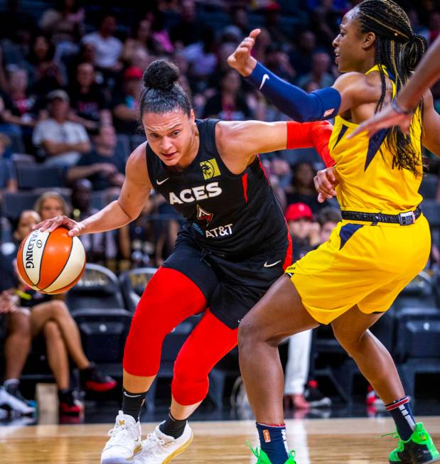 Las Vegas Aces guard Kayla McBride (21) drives the lane past Indiana Fever guard Kelsey Mitchel ...