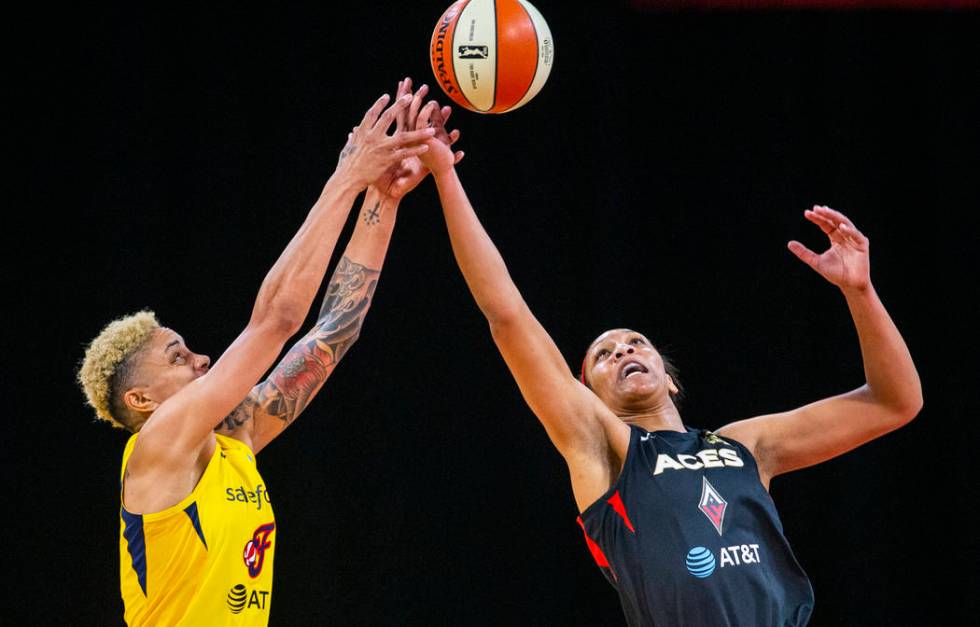 Indiana Fever center Teaira McCowan (15) and Las Vegas Aces forward A'ja Wilson (22) fight for ...