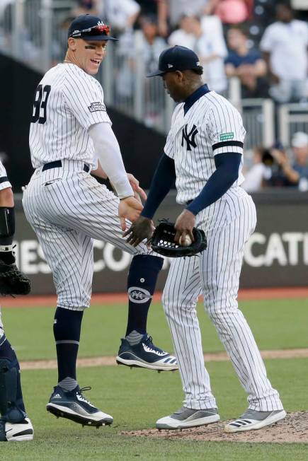 New York Yankees right fielder Aaron Judge, left, and relief pitcher Aroldis Chapman celebrate ...