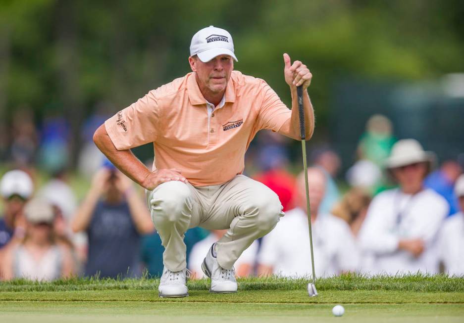 Steve Stricker lines up a putt on the fifth hole during the final round of the U.S. Senior Open ...