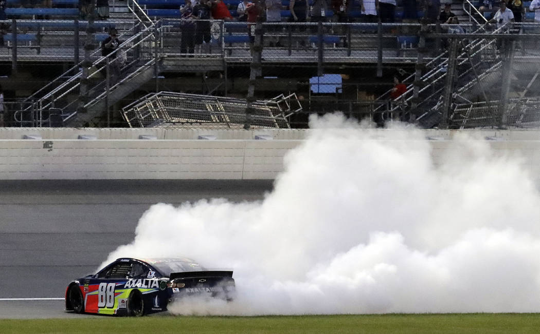 Alex Bowman burns out after winning the NASCAR Cup Series auto race at Chicagoland Speedway in ...