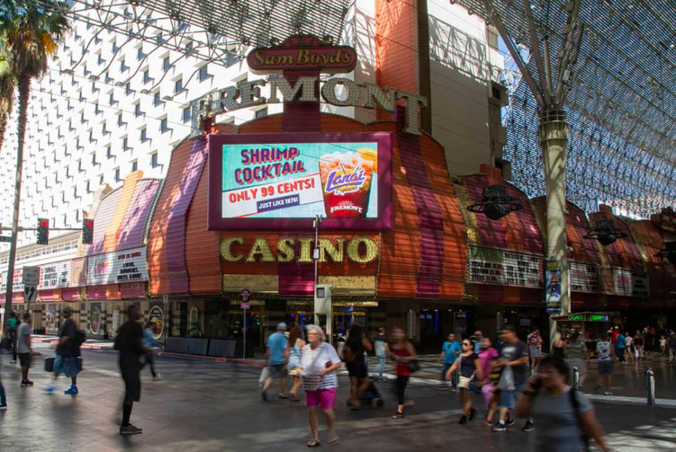 People walk by the Fremont Casino in Las Vegas, Wednesday, June 12, 2019. (Michael Blackshire/L ...