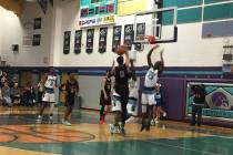 Liberty’s Julian Strawther goes up for a shot during a road basketball game at Silvera ...