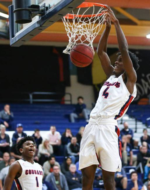 Coronado’s Tahj Comeaux (4) dunks against Foothill during a basketball game at Coronad ...