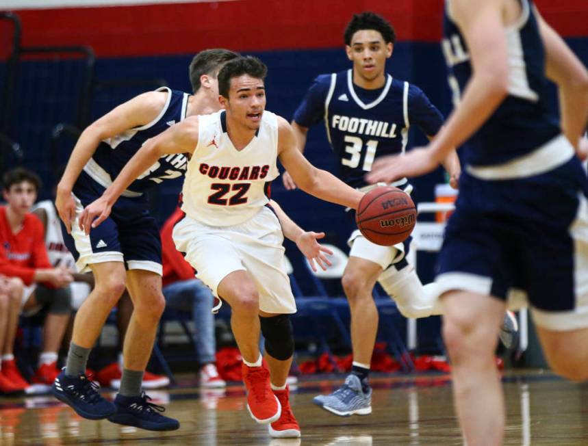 Coronado’s Patrick Simms (22) drives the ball against Foothill during a basketball gam ...