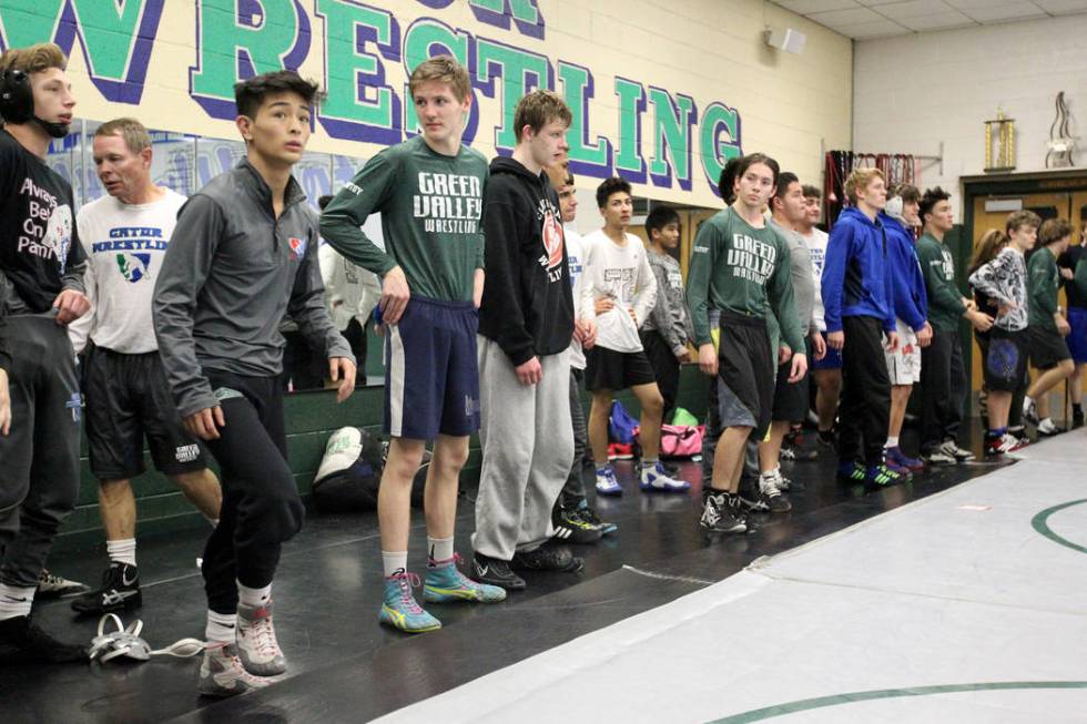 Green Valley High School junior wrestler Steele Dias, third from left, prepares to run with ...