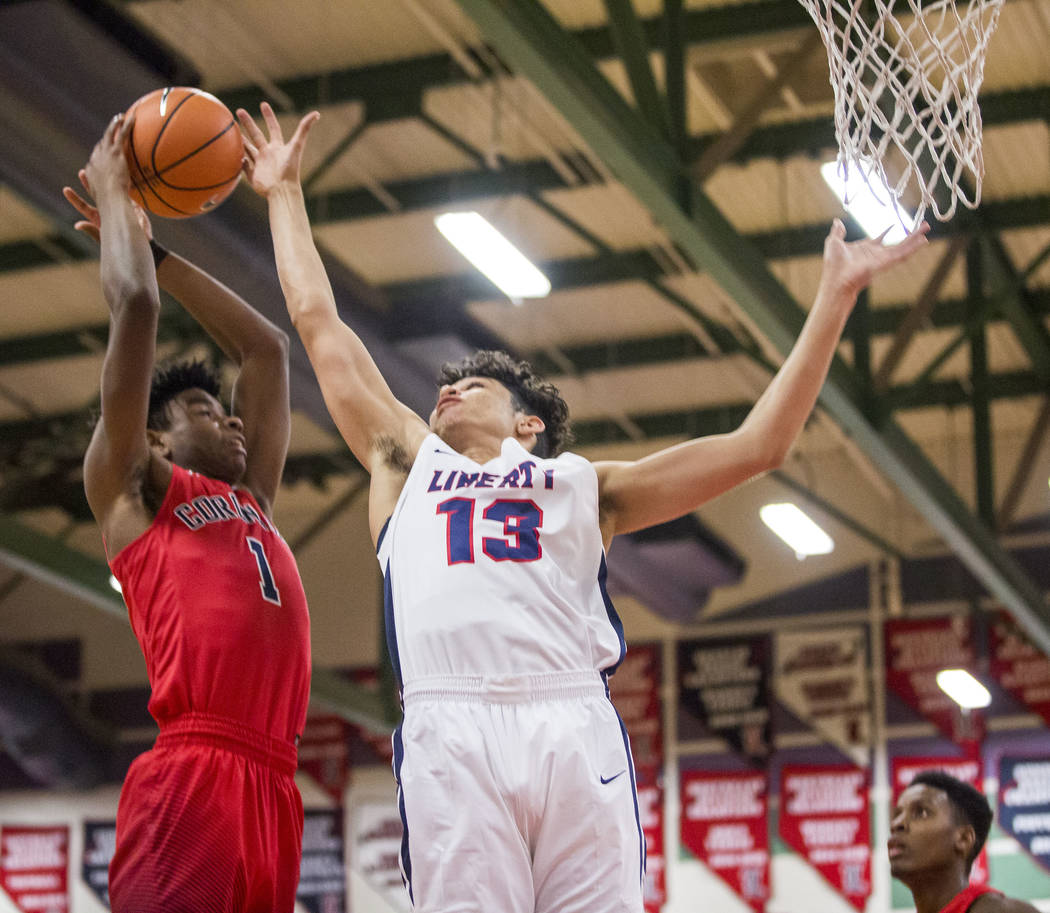 Coronado’s Jaden Hardy (1) shoots while Liberty’s Terrance Marigney (13) tries t ...