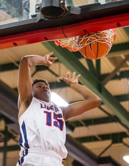 Liberty’s Cameron Burist (15) dunks while playing against Coronado at Liberty High Sch ...