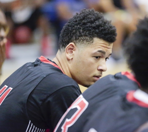 Point guard Skylar Mays of Mo Williams Elite listens to instruction on the bench during the ...