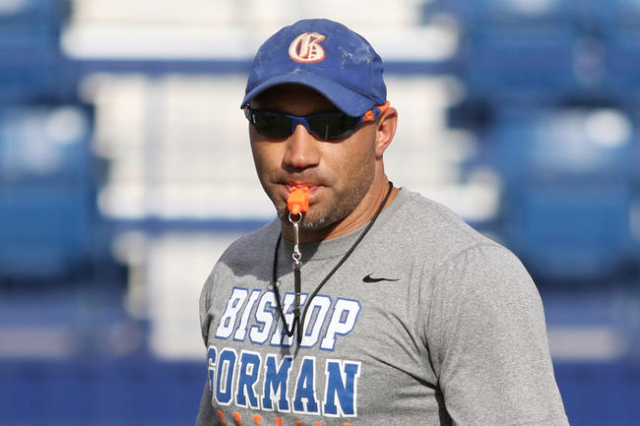 Bishop Gorman coach Kenny Sanchez runs offensive drills with the football team at Bishop Gor ...